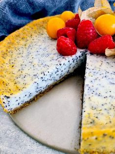 a cheesecake with berries and lemons on top