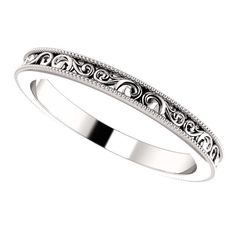 a white gold wedding band with filigrees and scrolls