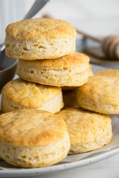 a stack of biscuits sitting on top of a white plate