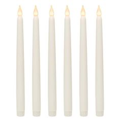 five white candles are lined up in a row