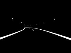 an empty road in the dark at night