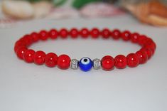 "Evil Eye Bracelet,Kabbalah Hamsa Evil Eye Bracelet,Nazar Mystic of Fatima,8mm Beads,Red Gemstone Bracelet,Men,Women,Protection,Good Luck * * * * * * * * * * * * * * * * * * * * * * * * * * * * * * * * * * The bracelet in the picture shown is 7\" size which fits an average wrist, please select your size from the drop down menu at checkout I will custom make your order, any questions please feel free to contact message me anytime, thank you very much. * * * * * * * * * * * * * * * * * * * * * * * Red Gemstone Bracelet, Women Protection, Hamsa Evil Eye, Hamsa Bracelet, 8mm Beads, Bracelet Men, Red Bracelets, Red Gemstones, Eye Bracelet