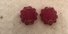 Retro charm. Vintage in excellent condition 1950s Ruby Red round floral clip-on Earrings. Purchased at an estate sale and sold vintage items in my crafts booth which is now closed. Will ship worldwide. Vintage Handmade Clip-on Earrings For Party, Handmade Vintage Clip-on Earrings For Party, Vintage Red Clip-on Earrings As Gift, Vintage Round Clip-on Earrings For Gift, Vintage Round Clip-on Earrings As Gift, Vintage Red Clip-on Earrings, Red Vintage Clip-on Earrings, Vintage Red Earrings For Party, Vintage Round Clip-on Earrings For Party