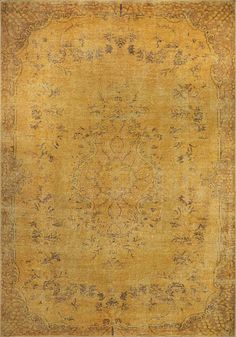 an antique rug is shown in yellow and brown tones, with intricate designs on the border