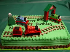 a birthday cake that is shaped like a train