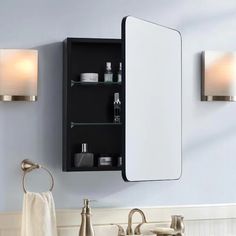 a bathroom sink with a medicine cabinet above it