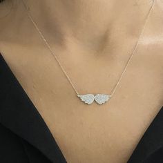 - Angel Wing Necklace is made with high-quality 925K Sterling Silver. - Dainty, delicate, elegant, charm, cute and trendy angel wing pendant necklace is a good example for a CZ layered charm pave jewelry. - 925K sterling silver angel wings pendant comes with a free 925K Sterling Silver chain and decorated with white cubic zirconia stones. - You receive CZ Angel Wing necklace in a beautiful and free gift box - Free shipping (Arrive within 4 business days to the US and Canada ( 1 day for productio Long Drop Necklace, Elegant Silver Winged Necklace, Elegant Silver Necklace With Angel Wings, Angel Wings Pendant, Diamond Angel Wing Necklace, Angel Wing Necklace Silver, Personalized Silver Wing-shaped Necklace, Wings Pendant, Gold Angel Wings