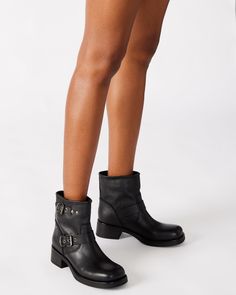 Elevate your style with the RAMPANT moto boot. Constructed with an ankle bootie design and sturdy lug sole, these boots are perfect for making a statement. The sleek leather adds a touch of sophistication to any outfit. 2 inch heel height 12 inch shaft circumference 5.5 inch shaft height Leather upper material Leather lining Leather sock Synthetic sole Imported Over The Ankle Boots Outfit, Moto Boots Outfit, Over The Ankle Boots, Boots Outfit Ankle, Women's Booties, Leather Socks, 2 Inch Heels, Leather Moto, Ankle Bootie