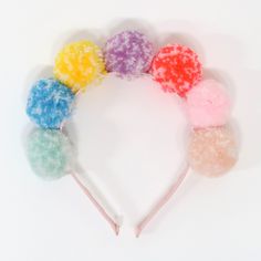 This pompom headband not only looks great, but has got real feel appeal too! A lovely 3D hair accessory to wear whenever you want to make a statement. 7 Pompoms in 7 bright colors. Flexible headband covered in pale pink ribbon. Suitable for ages 3+. Product dimensions: 8.25 x 6.5 x 1.5 inches. Tutu Craft, Rainbow Party Supplies, 3d Hair, Pom Pom Headband, Rainbow Party Decorations, Rainbow Parties, Glitter Headbands, Rainbow Paper, Rainbow Balloons