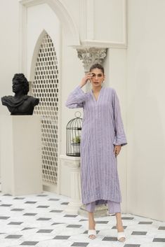 Introducing our stunning Lavender chiffon embroidered shirt hand-worked and embellished with minute mirror work details. Paired with matching raw-silk pants. This elegant dress is adorned with intricate details, featuring beautiful embroidery and embellishments. Elegant Sequined Palazzo Set With Straight Kurta, Elegant Sequined Straight Kurta Palazzo Set, Elegant Palazzo Set With Sequins And Straight Kurta, Elegant Straight Kurta Palazzo Set With Sequins, Elegant Sequined Kurta For Eid, Elegant Sequined Kurta, Elegant Purple Long Sleeve Palazzo Set, Elegant Sequined Palazzo Set In Georgette, Elegant Long Sleeve Purple Palazzo Set