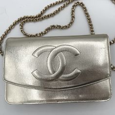 Such A Showstopper - This Is A Super Rare Piece. The Metallic Looks Gold In Some Light And Silver In Others. This Is Such A Perfect Bag For Either Everyday Or A Special Occasion. Comes With Certificate Of Authenticity And Chanel Authentication Card. Can Be Worn As Shoulder Bag, Crossbody Bag Or Clutch Condition: Has Some Minor Wear On The Top Left - Looks Like Some Leather Rubbing. Otherwise All Pockets, Zippers, Snap Are In Perfect Condition. Edges Are Perfect - This Bag Is Sturdy And Can Stand On Its Own. Wooden Handbag, Metallic Leather Bag, Embroidered Handbag, Ladies Bag, Flower Bag, Handmade Flower, Chanel Bags, Perfect Bag, Metallic Leather