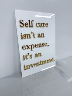 a sign that says self care isn't an expensive it's an investment