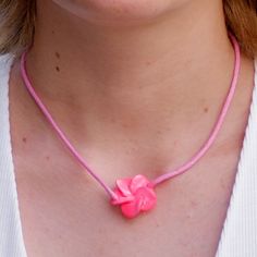 Single Strand 16 inch Pink or White Cord Choker Necklace with matching color Fimo Plumeria Flower slider pendant In stock. Shipped daily from Florida USA Adjustable Flower Pendant Necklace For Birthday, Adjustable Flower Necklace For Birthday, Valentine's Day Flower Necklace With Adjustable Fit, Pink Flower Necklace, Pink Adjustable Flower Pendant Necklace, Pink Flower Choker Necklace, Pink Flower Charm Pendant Necklace, Pink Adjustable Flower Shaped Necklace, Pink Flower Charm Necklace