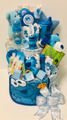 a blue gift basket filled with baby items