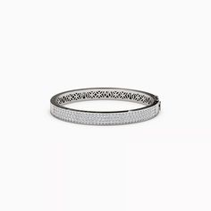 The meticulously crafted floral detailing on the metalwork offers a glimpse into a secret world of shimmering diamonds. Rare Diamonds, Diamond Bangle Bracelet, Crystal Structure, Light Shadow, Diamond Bangles Bracelet, Vs Diamond, Diamond Bangle, Bangle Bracelet, Metal Working