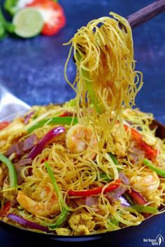 the noodles are being served with chopsticks in a bowl, and there is noodle on top