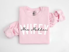 a pink sweatshirt with the words mrs maddelen printed on it and a scrunffle