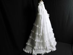 Vintage English Christening Gown with Lots of Ruffles and Valenciennes Lace This charming  and very Romantic gown dates from the turn of the last century from about c.1890 to perhaps 1920,  and is in a classic style. This gown follows a traditional pattern with a high waisted bodice and the full skirt embellished with ruffles of Valenciennes lace all around.  Although this gown is Victorian, I think it has an 'Elizabethan look' with the high neck edged in lace, and the lace ruffles over the shou Victorian Ruffled Dress For Vintage Events, Regency Style Victorian Dress With Ruffles For Formal Occasions, Elegant Vintage White Victorian Dress With Ruffles, Victorian Gown With Ruffles For Costume Events, Victorian Formal Gown With Ruffles, Historical Daywear Dresses With Ruffles, Vintage White Victorian Day Dress With Ruffles, Vintage White Victorian Dress With Ruffles For Daywear, White Regency Victorian Dress With Cancan