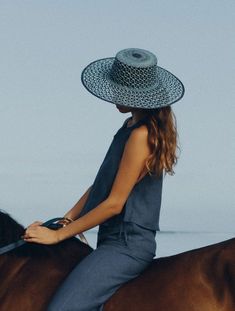 Carlota Straw Hat in Baby Blue + Navy Blue from Van Palma 100% Toquilla adjourned Straw Hat 12 cm width Handwoven in Ecuador Made in France 🇫🇷 56-S / 57-M / 58-L Since 2014, French brand Van Palma has been breathing new life into the accessories aisle with its elegant year-round hat collections. At the helm of this sunny, California-inspired label is Victoria Sanguinetti, a young designer from Marseille who decided to follow her passion rather than her business degree. Chic Blue Beach Hat, Navy Hat For Spring, Chic Blue Straw Hat For The Beach, Blue Flat Brim Boater Hat For Beach, Blue Panama Hat With Curved Brim For Beach, Blue Boater Hat With Curved Brim For Beach, Blue Panama Hat For Beach With Curved Brim, Blue Sun Hat For Beach And Kentucky Derby, Navy Wide Brim Sun Hat For Summer