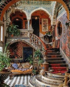 an elaborately decorated staircase leads up to the second floor