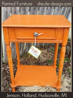 an orange end table with a sign on it that says painted furniture, shizzle - designed com