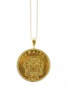 THE JAMAICAN Ackee Coin Necklace Traditional Coin Medallion Necklace For Gift, Traditional Coin Medallion Necklace As A Gift, Traditional Coin Necklaces For Collectors, Traditional Coin Necklaces As Collectibles, Traditional Brass Coin Necklace, Traditional Medallion Necklace With Coin Pendant, Traditional Round Jewelry For Commemoration, Traditional Coin Pendant Necklace For Gift, Traditional Brass Coin Medallion Necklace