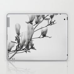 a black and white photo of flowers on a tree branch laptop & ipad skin set