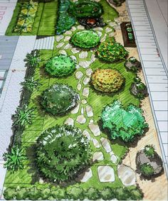 a paper model of a garden with trees and bushes on it's sides, along with rulers