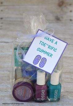 a bag filled with nail polish and other items for the summertime treat or spa party