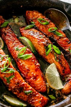 salmon with lemon and herbs in a skillet