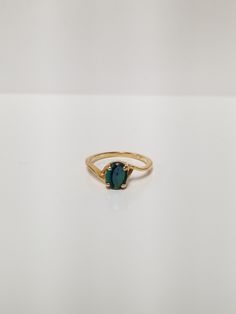 "Thanks for shopping our vintage estate store. We tend to sell well below wholesale and truly hope you enjoy all of our items. Many of the items are one of a kind, so please enjoy scrolling through the pictures and hopefully something will catch your eye. Spots are from the camera or reflections. Estate 14k yellow gold created blue .50ct opal ring.  Just stunning.  Ring size: 6.5 Setting: 1/4\" 8mm by 6mm Band width: 1.5mm Weight: 2.14 grams You will love this ring. Marked 14k. Opal is a doublet Classic Oval Birthstone Ring With Ethical Gemstones, Yellow Gold Oval Emerald Birthstone Ring, Oval Yellow Gold Emerald Ring As Birthstone, Oval Yellow Gold Emerald Ring With Birthstone, Classic Oval Opal Ring With Polished Finish, 14k Gold Solitaire Ring With Oval Cabochon, Classic Sapphire Ring Oval Cabochon, Vintage Oval Emerald Ring In 14k Gold, Oval Blue Opal Ring In 14k Gold