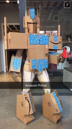 an amazon prime robot made out of cardboard boxes