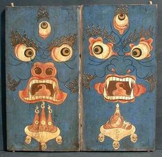 an old book with two paintings on the front and back covers that look like monsters