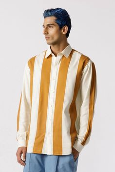 Full sleeves button down shirt in mustard and white cotton showcasing straight panels arranged in a striped pattern. Fit: Regular fitColor: off whiteFabric: Cotton Classic White Shirt With Signature Stripes, White Shirt With Signature Stripes For Spring, White Button-up Shirt With Striped Cuffs, Spring White Shirt With Signature Stripes, Collared Cotton Shirt With Signature Stripes, White Long Sleeve Shirt With Contrast Stripes, Casual White Shirt With Signature Stripes, White Button-up Shirt With Contrast Stripes, White Collared Shirt With Contrast Stripes