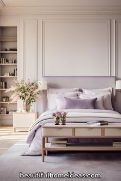 a bedroom with white walls and purple bedding