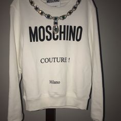 Designer Sweatshirt With Attached Rhinestone Size 38 White Long Sleeve Tops With Rhinestones, Moschino Sweatshirt, Cottagecore Sweater, Hooded Jean Jackets, Hat Jewelry, Chic Cardigan, Varsity Sweater, Black Wool Blazer, Moschino Couture