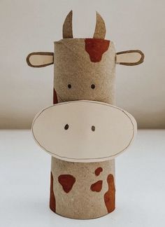 two toilet paper roll animals are sitting next to each other