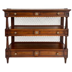 an antique wooden shelf with three drawers