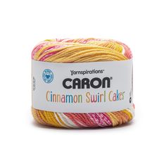 the yarn is yellow, pink and white with an orange stripe on it's side