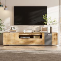 a living room with a large television mounted on the wall and wooden furniture in front of it