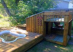 a dog house with a hot tub in the middle