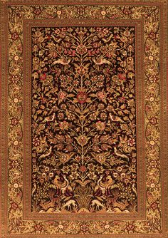 an intricately designed rug with flowers and leaves on the center, surrounded by ornate border