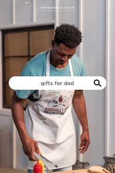 a man in an apron is preparing food on a cutting board with the words gifts for dad