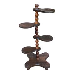 three tiered wooden stand with wood beads on the top and bottom, against a white background