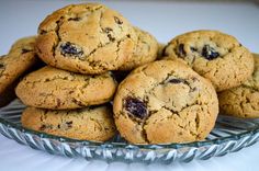 a glass bowl filled with cookies on top of a table