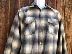 Pendleton button up shirt. Labeled as a size Medium.  Condition - has a few holes shown in last three photos. Measurements taken across front laid flat 22" armpit to armpit 30" length 19" across shoulders 24" arm length Rustic Long Sleeve Flannel Shirt For Fall, Rugged Brown Shirt For Fall, Brown Button-up Flannel Shirt For Outdoor, Vintage Brown Flannel Shirt With Buttons, Brown Flannel Shirt With Button Closure For Winter, Brown Winter Flannel Shirt With Button Closure, Winter Brown Flannel Shirt With Button Closure, Vintage Shirt For Fall Outdoor Events, Brown Winter Flannel Shirt With Buttons