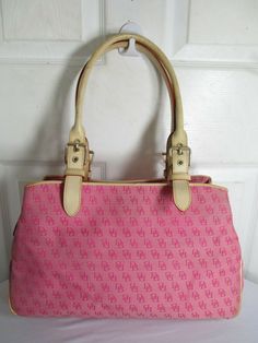 DOONEY & BOURKE  PINK MONOGRAM DB LOGO JACQUARD CANVAS/LEATHER   SHOULDER BAG NO ORIGINAL RECEIPT, NO BOX, NO DUST BAG    BRAND: DOONEY & BOURKE STYLE: SHOULDER TOTE COLOR: PINK MATERIAL:  JACQUARD CANVAS/LEATHER LINING: FABRIC SIZE:  14" x 9½" H x 4" D CLOSURE: MIDDLE TOP ZIP + 2 BUTTONS  INTERIOR: 3 OPENINGS,1 ZIPPED POCKETS, PHONE POCKET, KEY CLIP    APPROXIMATE MEASUREMENTS:  BAG DEPTH: APPROXIMATELY 4" BAG LENGTH: APPROXIMATELY 14" BAG HEIGHT: APPROXIMATELY 9½"  STRAP DROP: APPROXIMATELY 10 Pink Monogram Canvas Shoulder Bag For Shopping, Pink Monogram Canvas Shoulder Bag For Travel, Pink Monogram Canvas Shoulder Bag For Daily Use, Designer Pink Coated Canvas Shoulder Bag, Pink Designer Coated Canvas Shoulder Bag, Pink Monogram Canvas Rectangular Shoulder Bag, Pink Rectangular Monogram Canvas Shoulder Bag, Db Logo, Pink Monogram