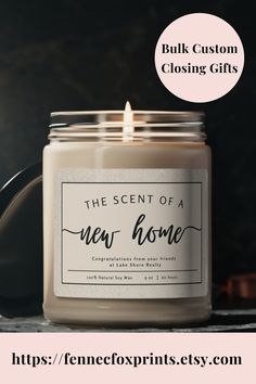 a candle with the scent of a new home on it