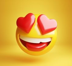 a smiley face with two hearts on it's cheek and eyes closed, against a yellow background