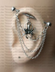 a metal spider with chains and spikes attached to it